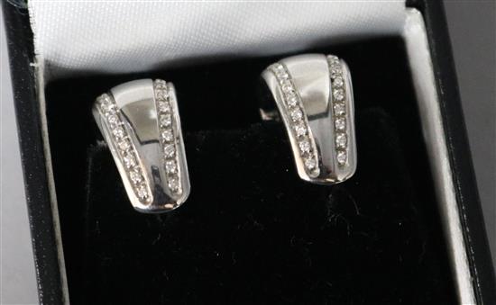 A pair of Italian 18ct white gold and diamond set half loop earrings.